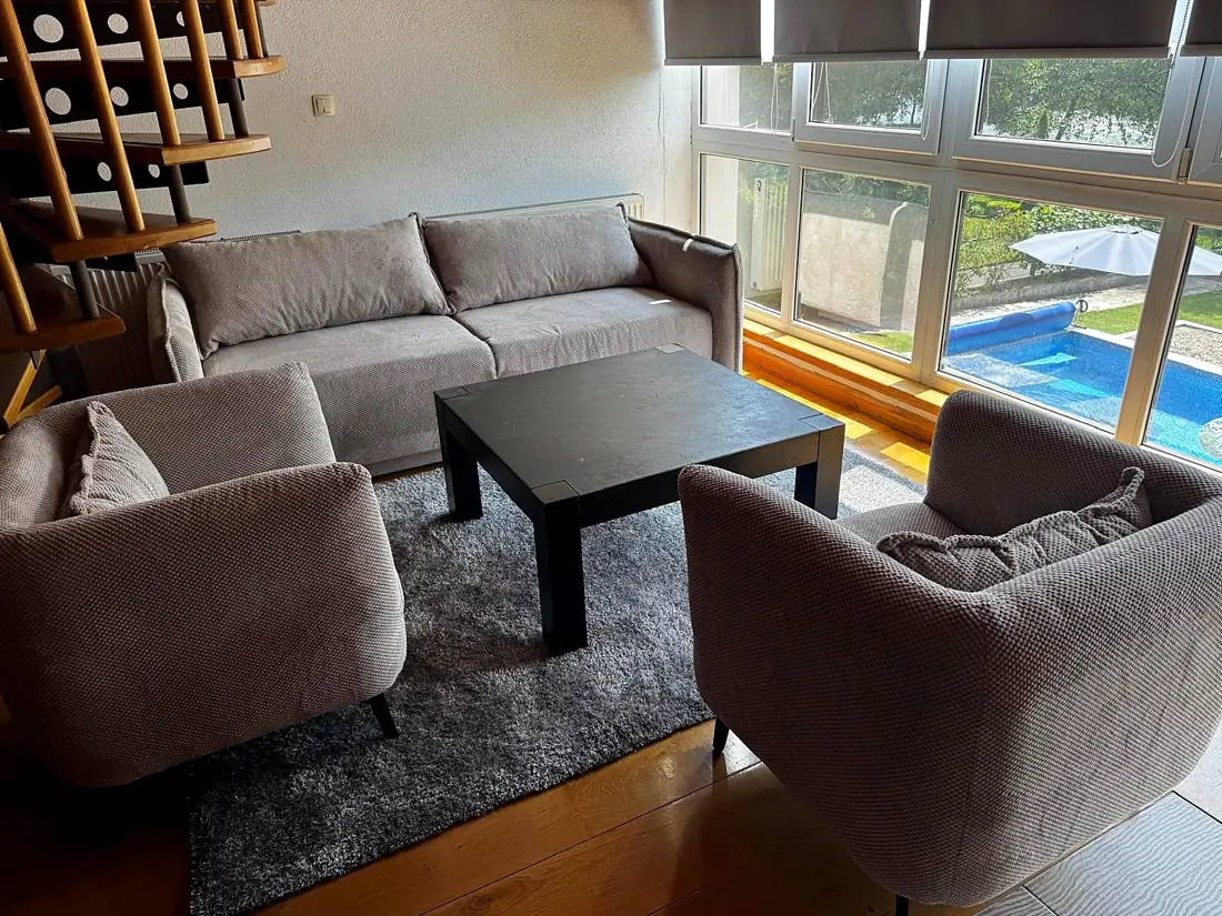 River Raft Villa — living room with pool view